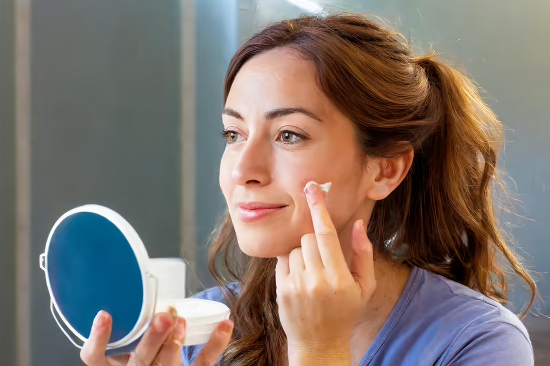 A girl putting moisturizer on her face